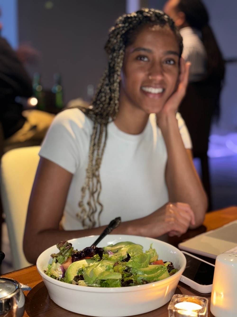 A guest enjoying her salad at Banna